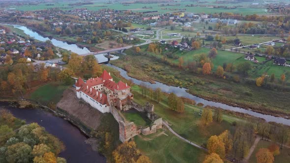 Bauska Medieval Castle Ruins Complex and Park From Above Aerial Shot 4K Video