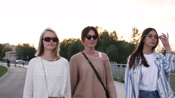 Serious Young Women with Glasses Walking.