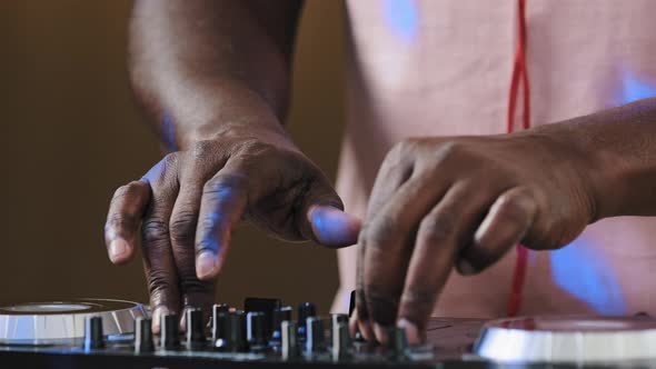 Closeup Dj Mixer Controller Desk in Club Musician Studio Home Disco Party Old African Male Hands