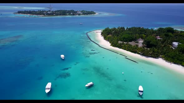 Aerial tourism of tropical shore beach trip by clear lagoon with white sand background of a dayout n