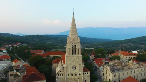 Moving aerial view sideways of the St. Nicholas Church In Selca Croatia Europe