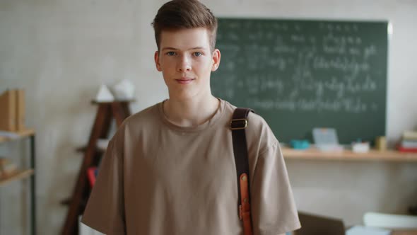 Portrait of Young Male Student in Classroom