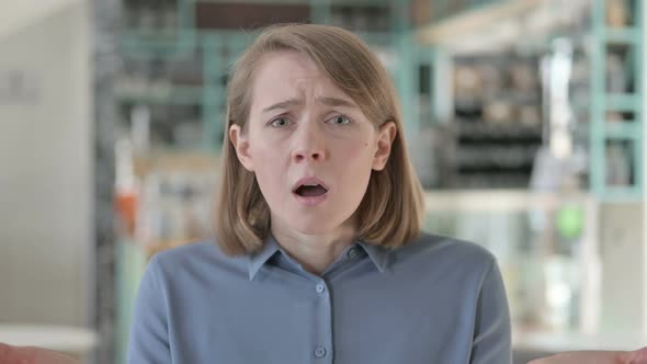 Portrait of Young Woman Reacting to Loss