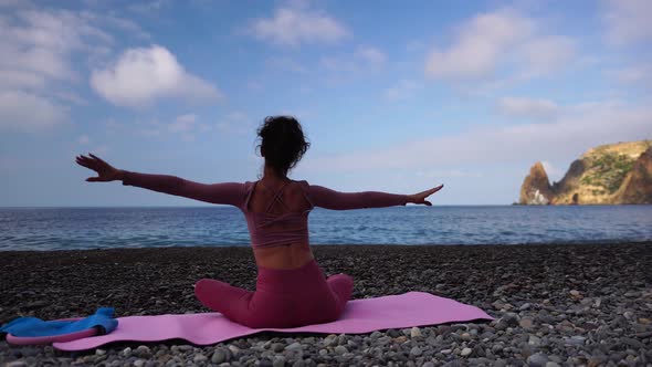 Young Woman with Black Hair Fitness Instructor in Leggings and Tops Doing Stretching and Pilates on