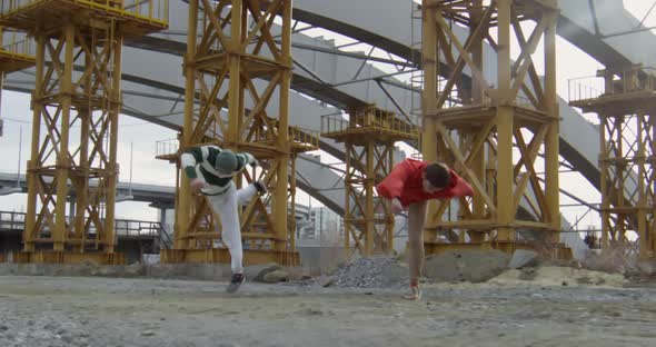 Professional Parkour Athletes Doing Tricks at Construction Site