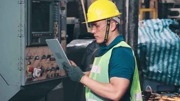 Smart Factory Worker Using Machine in Factory Workshop