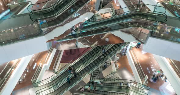 Escalator in Modern Multi Level Shopping Mall Crowd of People. Rush Hour Time Lapse