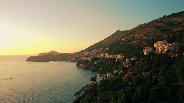 Dubrovnik city and coast at sunset in Croatia. Wide aerial landscape view