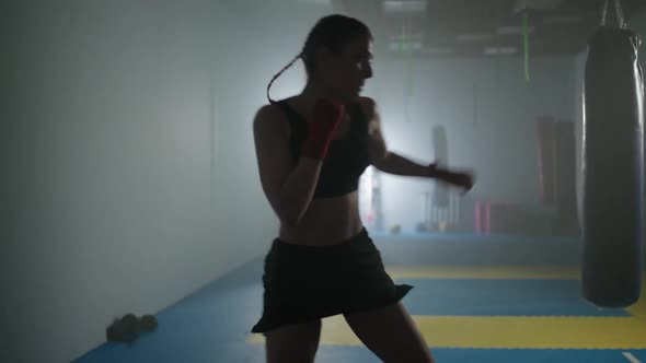 Woman Power Female Fighter Trains His Punches and Defense in the Boxing Gym Contour Lighting Female