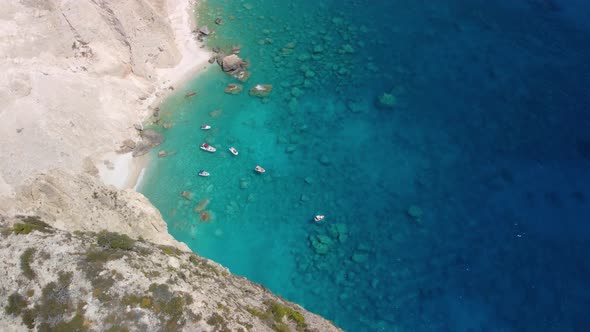 Pleasure boats anchored at Mizithres cliff rock in Zakynthos Ionian island, Greece.