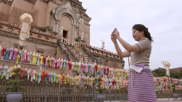 adult mature asian female woman wearing tradition dress tourists travel to the ancient