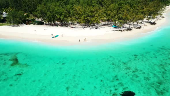 Loving Family Walks on a White Beach, Mauritius