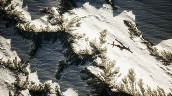 Helicopter Above Mountains in Snow