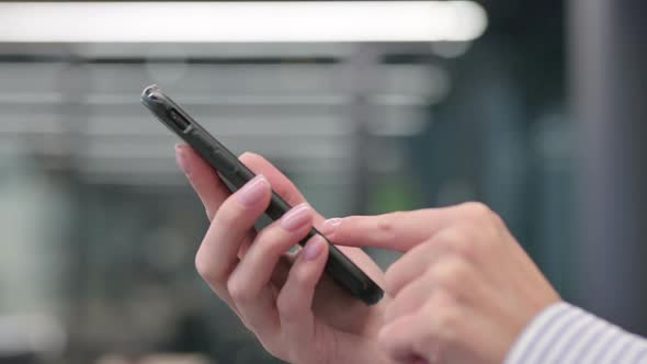 Close up of Hands of Woman Using Smartphone