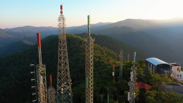 Television and Radio Towers with Mountains in the Background