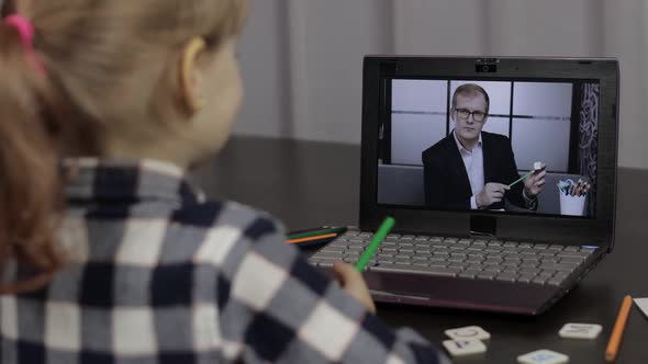 Girl Pupil Distance Education Lesson with Teacher, Using Digital Laptop at Home