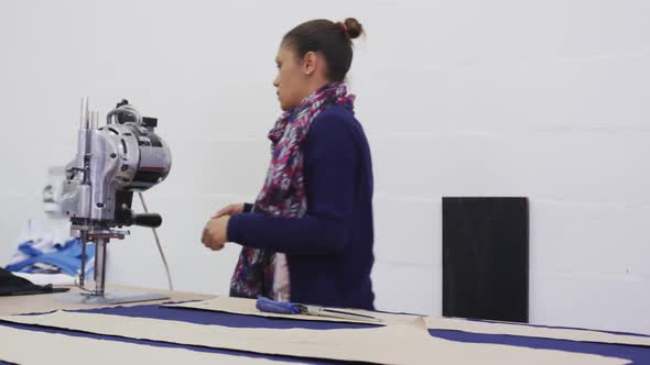 Mixed race woman working in factory