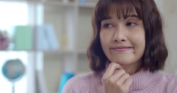 Headshot portrait of Thoughtful Young Woman with happy