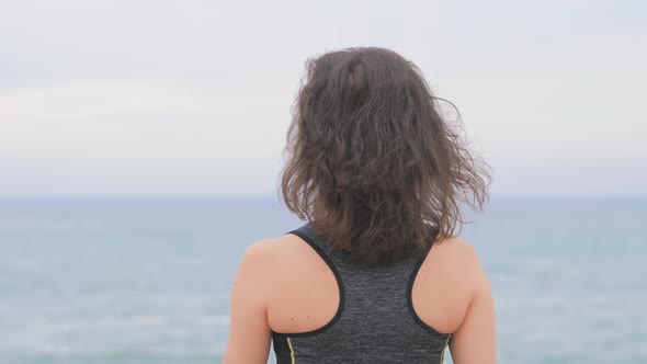 Woman Jogger Doing Exercises and Looking Data on Fitness Smart Watch