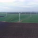 Large Wind Turbines with Rotating Blades in Field, Aerial View - VideoHive Item for Sale