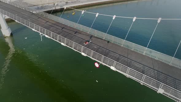 Aerial view of woman doing exercise in bridge on Abu Dhabi, U.A.E