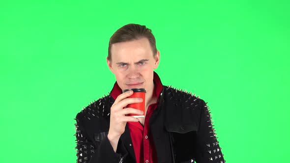 Guy Drinks Unpalatable Coffee and Is Disgusted on Green Screen