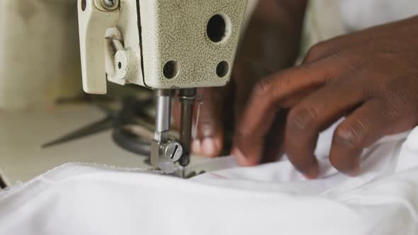 African man sewing tissue