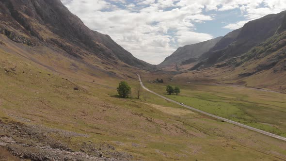 Glencoe Scotland Flying Low East Along Foot Of Mountain Aerial 