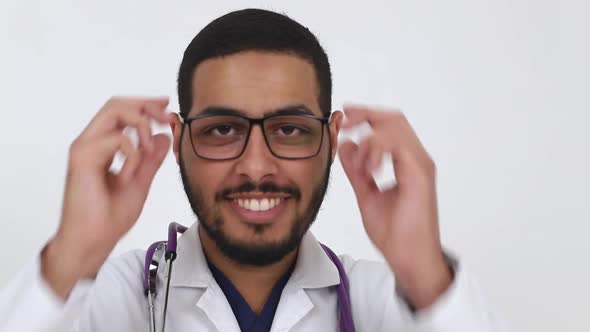 Smiling face of a young Arab man close-up.