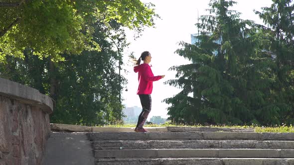 Young Woman Jumping with Skipping Rope Outdoors