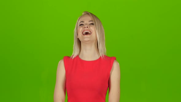 Blonde Girl in Red Dress Sincerely, Contagious Laughs. Green Screen