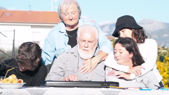 Man Explaining How to Use Electrical Piano Outdoor to His Grandchildren