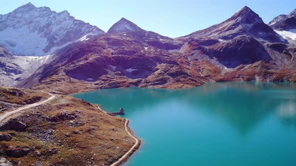 Picturesque Landscape Of Mountain And Tranquil Blue Waters Of Weisssee Lake And Reservoir In Summer