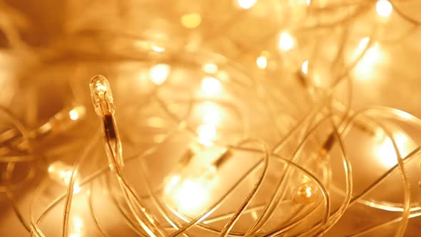 Golden sparkles Christmas lights with one in focus slow motion 1080p FullHD footage - Gold and yello