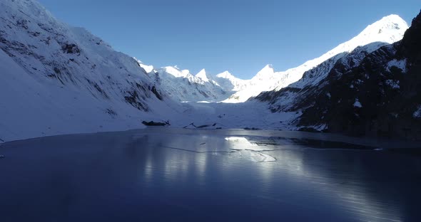 Drone flying over glacier lagoon in Tibet,China.Aerial view drone footage 