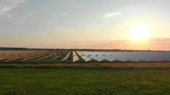 Drone Fly Over Solar Farm, Renewable Green Energy and Electrical Technology, Field of Solar Panels