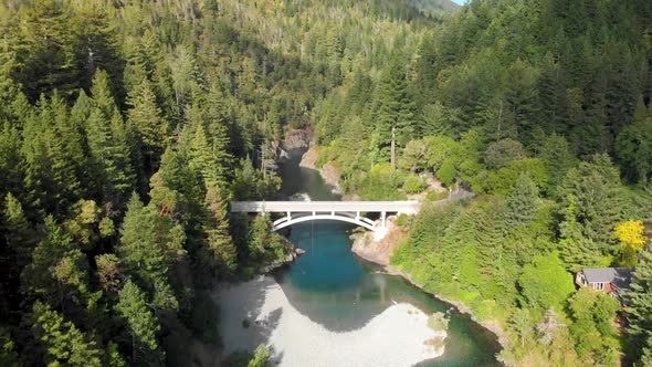 4K Aerial Bridge Crossing Smith River near Redwood Forest in Humboldt