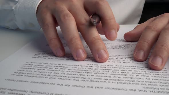 Businessman Sign Signature on Document Contract Paper at Office Desk