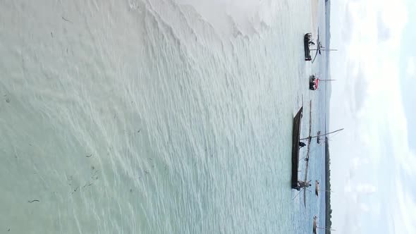 Vertical Video of the Ocean Near the Coast of Zanzibar Tanzania Aerial View