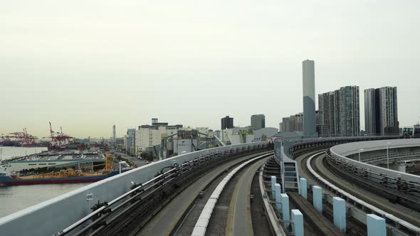 Scenery of a train traveling on the rail of Yurikamome Line in TokyoJpd7005 2 E