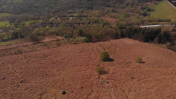 Drone travelling towards a Peak in the Peak District while panning up from Bamford Edge Quicker Alte