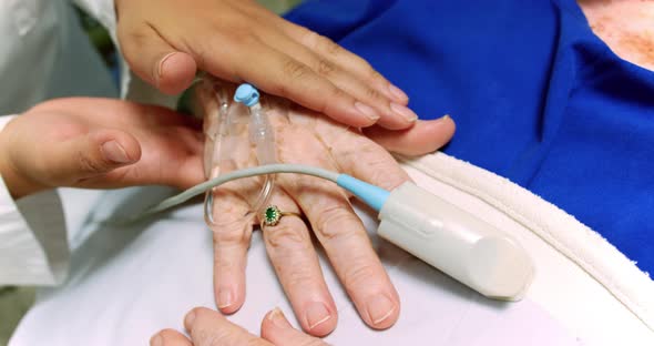 Female doctor consoling active senior patient 4k