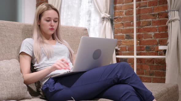 Woman in Tension and Headache Working on Laptop Home