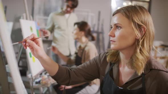 Woman Painting At Art Lesson