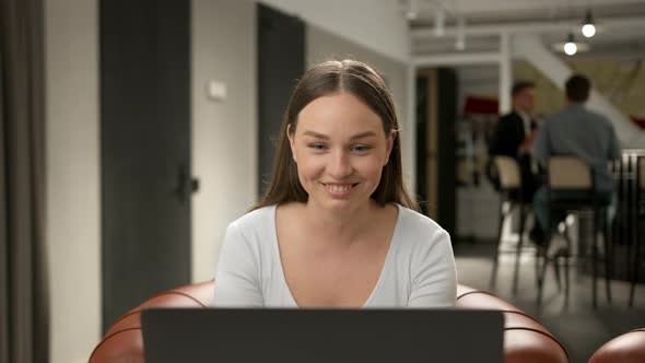 Female office worker chatting on zoom with work colleagues or clients