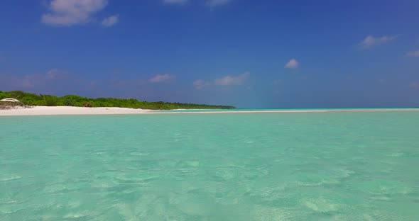 Beautiful above island view of a white paradise beach and aqua turquoise water background in hi res 