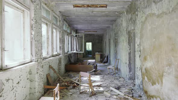 Abandoned And Empty School Hallway With Lots Of Garbage And Peeling Paint On Wall, Chernobyl Exclusi