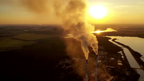 Factory chimney smoking. Gas emissions coming from the smoking chimney pipes of the power plant