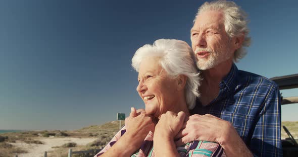 Senior couple enjoying free time at the beach