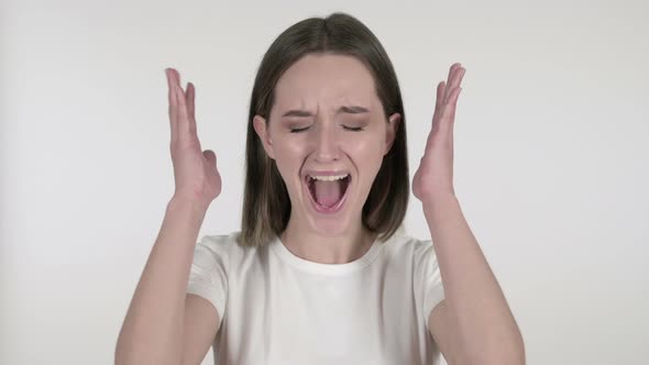 Screaming Angry Young Woman on White Background